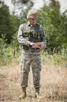 Military soldier using digital tablet