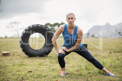 Fit woman performing stretching exercise