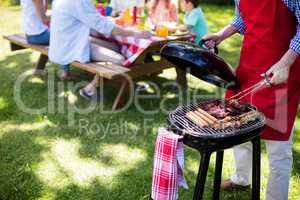 Man barbequing in the park
