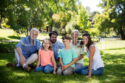 Multi generation family sitting in park