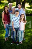 Happy multi generation family standing in park