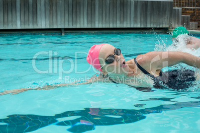 Mature woman swimming in pool