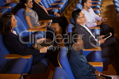 Business executives listening to speech