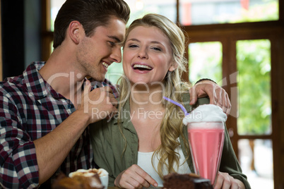 Romantic couple spending quality time in coffee shop