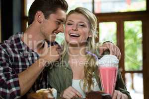 Romantic couple spending quality time in coffee shop
