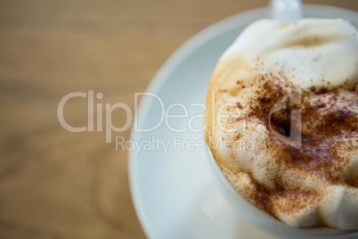 Overhead shot of coffee cup with creamy froth