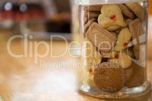 Cookies in jar on counter at coffee shop