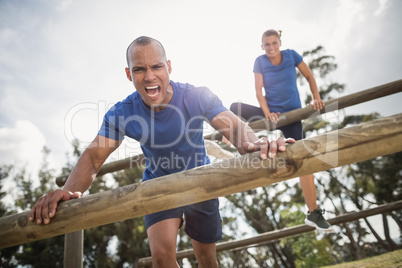 People jumping over the hurdles during obstacle course