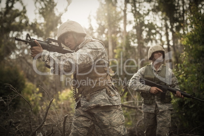 Military soldiers during training exercise with weapon