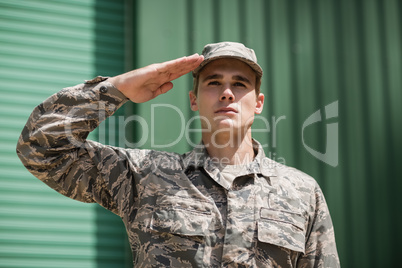 Close-up of military soldier giving salute