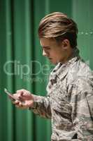 Military soldier using mobile phone