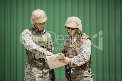 Soldiers having discussion over map