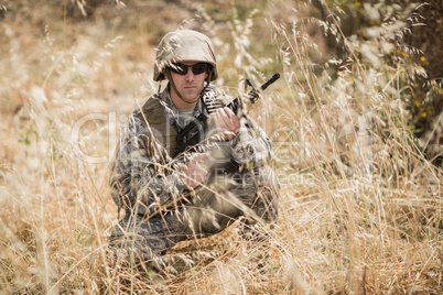 Military soldier guarding with a rifle