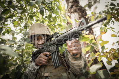 Military soldier guarding with a rifle