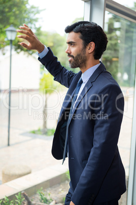 Businessman looking through the window