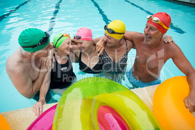 Happy senior swimmers enjoying in pool