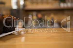 Muffin on wooden counter in coffee shop