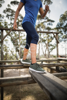 Fit woman practicing during obstacle course