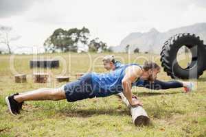 Fit people performing pushup exercise