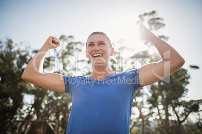 Fit woman cheering in joy