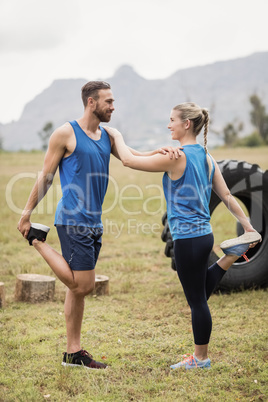 Fit people performing stretching exercise