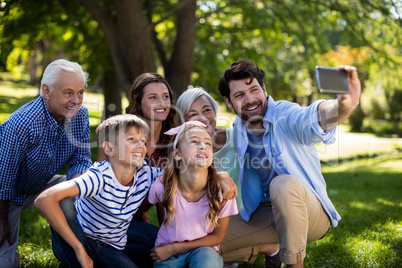 Multi generation family taking a selfie on mobile phone