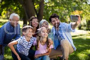 Multi generation family taking a selfie on mobile phone