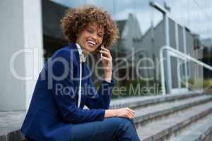 Businesswoman talking on mobile phone in the premises