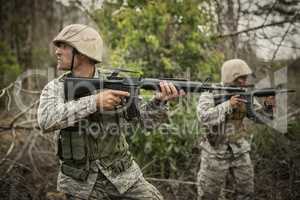 Military soldiers during training exercise with weapon