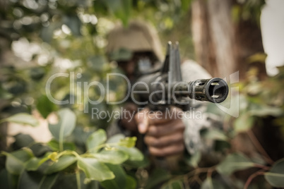 Military soldier guarding with a rifle