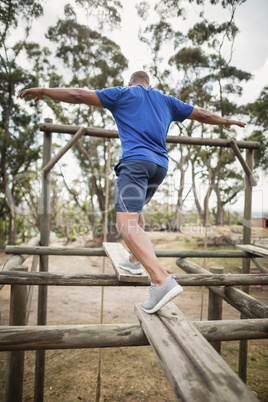 Fit man during obstacle course training