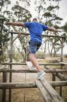 Fit man during obstacle course training