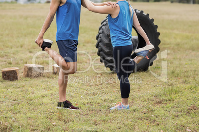 Fit people performing stretching exercise Fit people performing stretching exercise