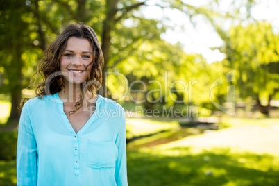 Smiling woman standing in garden