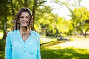 Smiling woman standing in garden