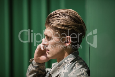 Military soldier talking on mobile phone