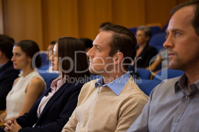 Business executives listening to speech