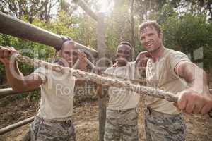 Portrait of military soldiers smiling during obstacle training