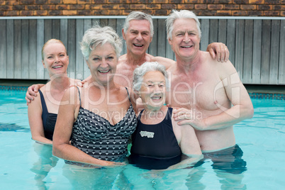 Senior swimmers standing in pool