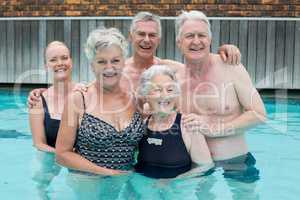 Senior swimmers standing in pool