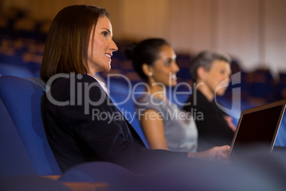 Business executives listening to speech