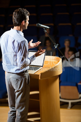 Male business executive giving a speech