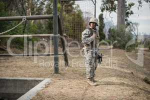 Military soldier during training exercise with weapon