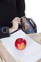 Artist is going to draw an apple
