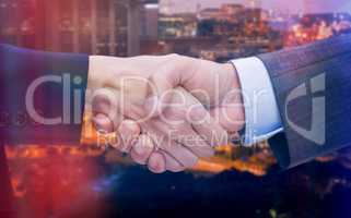 Composite image of businessman and woman doing handshake