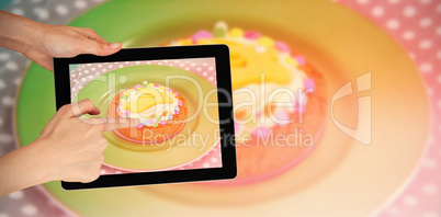 Composite image of hands touching digital tablet against white background