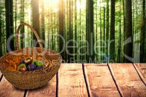 Composite image of easter eggs in paper nest basket