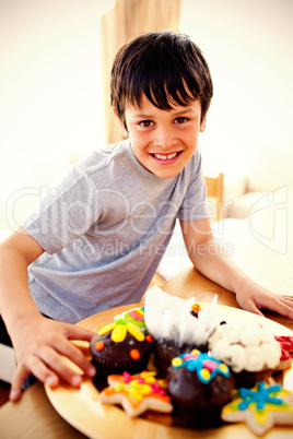 Happy boy eating colorful confectionery