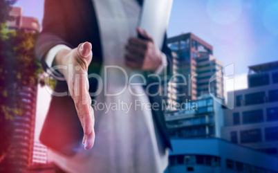 Composite image of corporate woman offering handshake