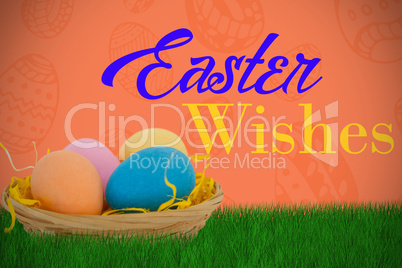 Composite image of colorful easter eggs in wicker basket